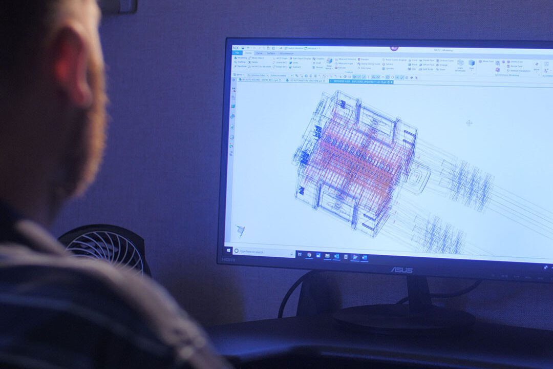 Man looking at CAD software